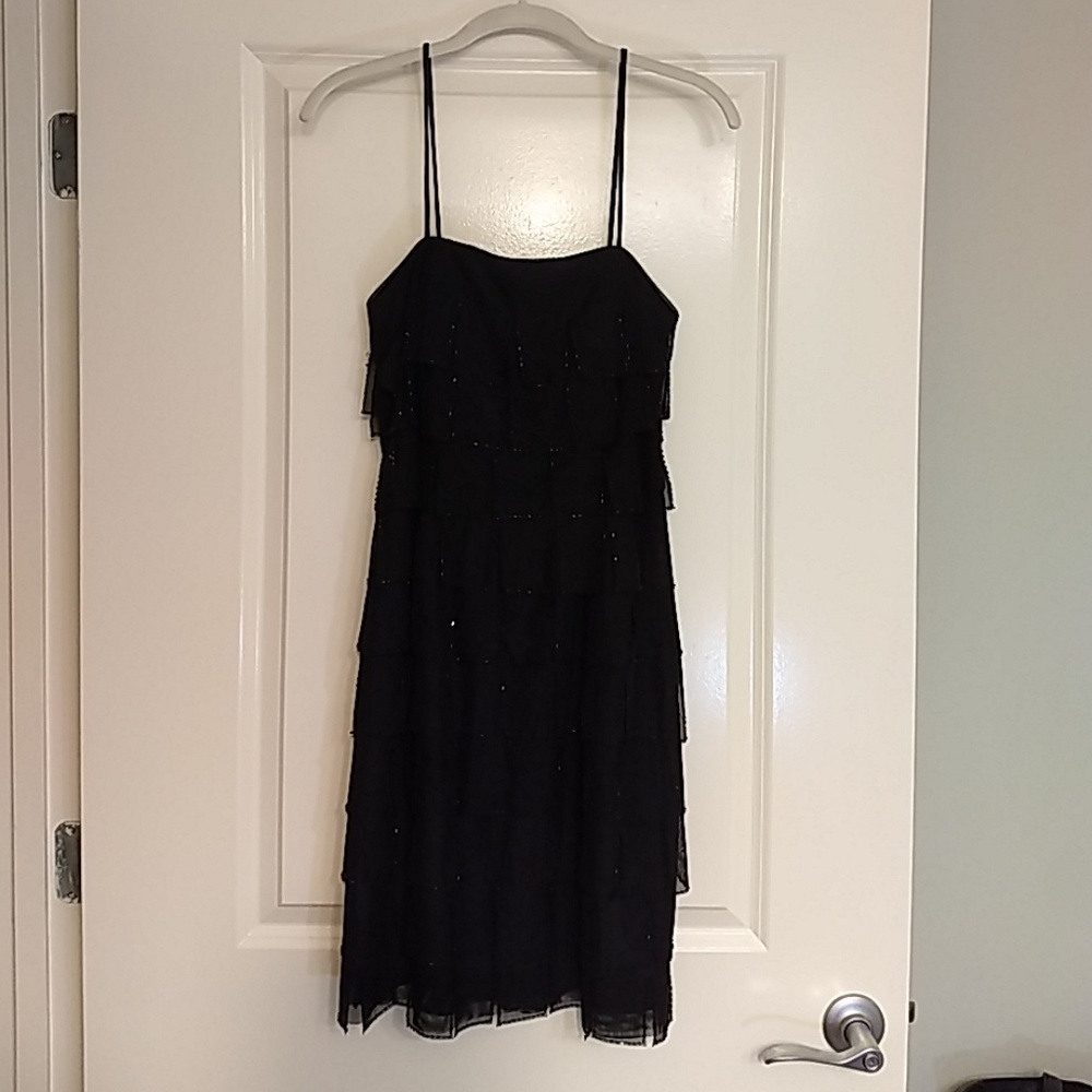 Black spaghetti strap cocktail dress.